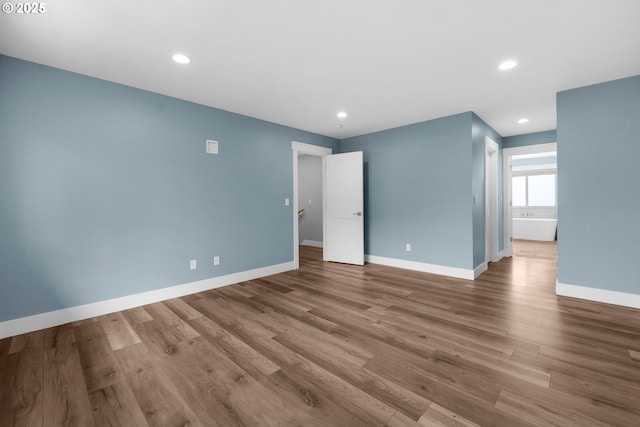 35681 Bella Ridge Loop, Astoria, OR 97103 - spare room with wood finished floors, baseboards, and recessed lighting