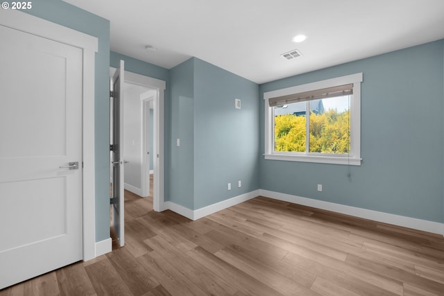 35681 Bella Ridge Loop, Astoria, OR 97103 - unfurnished bedroom featuring baseboards, wood finished floors, and recessed lighting