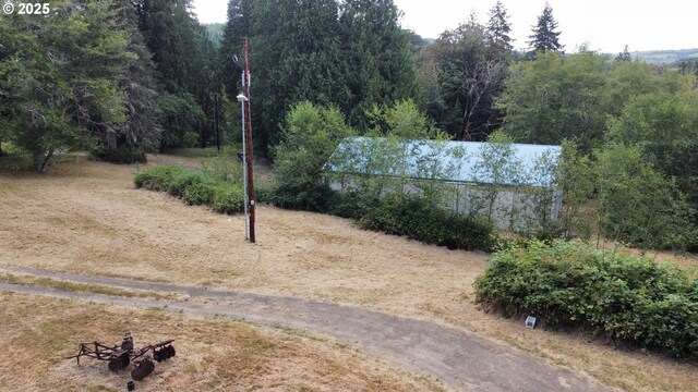 view of yard featuring a view of trees