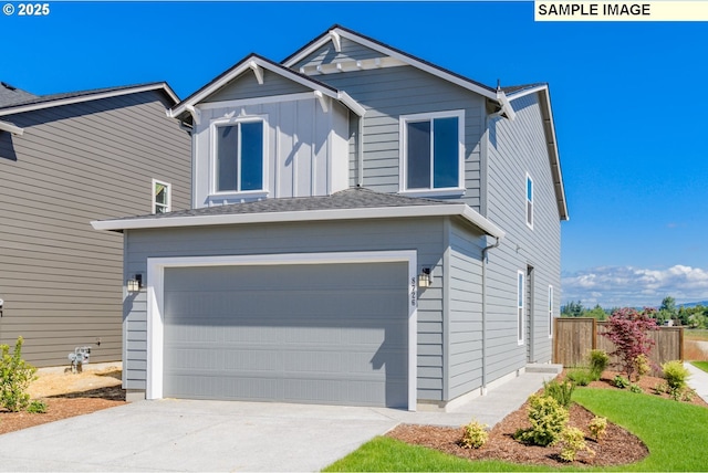 view of front of property featuring board and batten siding, fence, driveway, and an attached garage