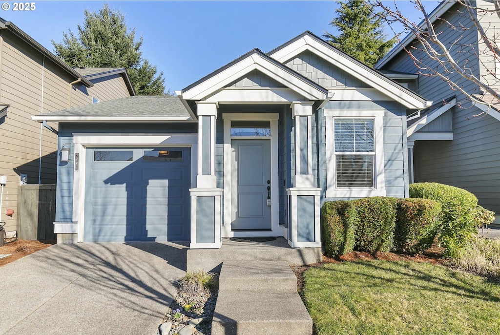 entrance to property with a yard and a garage