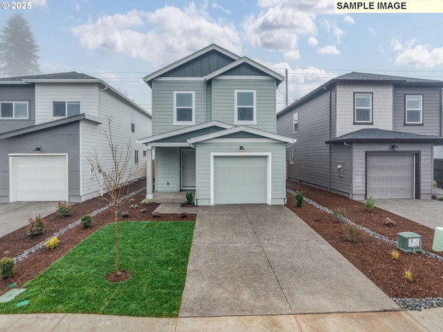 view of front property featuring a garage and a front yard