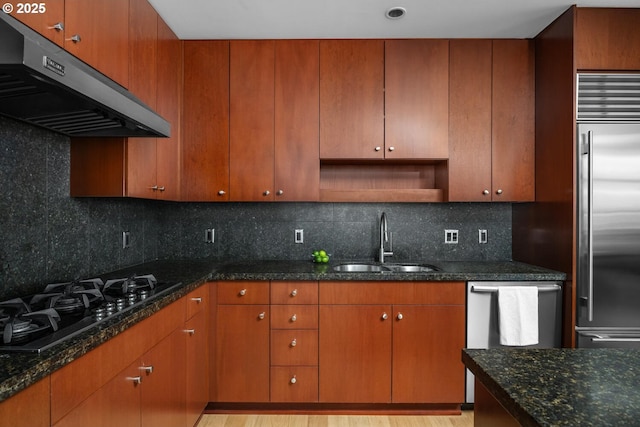 1025 NW Couch St Unit 1320, Portland, OR 97209 - kitchen featuring ventilation hood, stainless steel appliances, dark stone counters, decorative backsplash, and open shelves