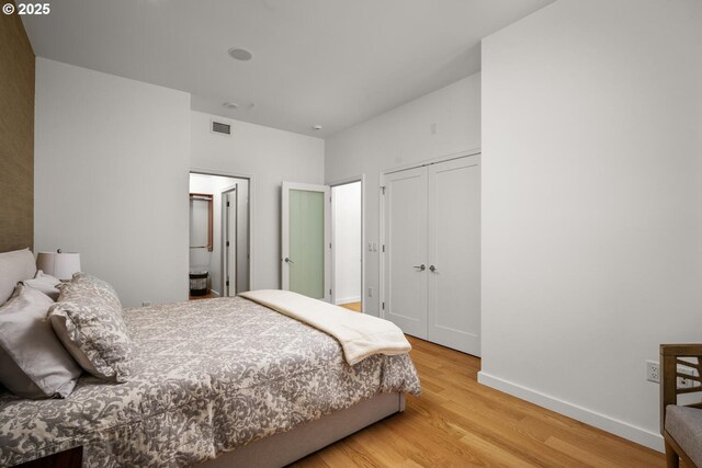 1025 NW Couch St Unit 1320, Portland, OR 97209 - bedroom featuring wood finished floors and a closet