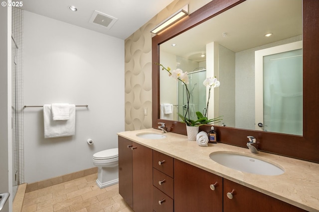 1025 NW Couch St Unit 1320, Portland, OR 97209 - bathroom featuring a shower stall, double vanity, and recessed lighting