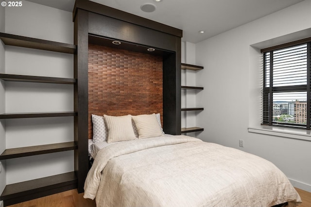 1025 NW Couch St Unit 1320, Portland, OR 97209 - bedroom with wood finished floors and recessed lighting