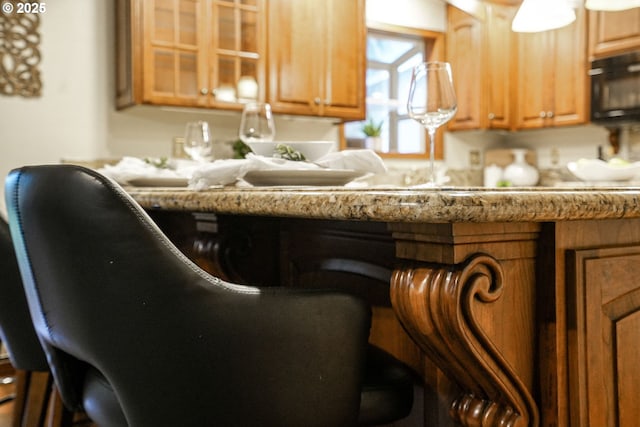 kitchen featuring light stone counters