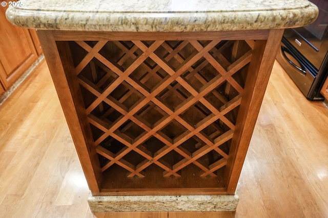 wine area featuring light wood-type flooring