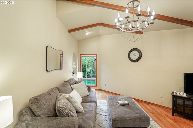 living room with hardwood / wood-style floors, lofted ceiling with beams, and an inviting chandelier