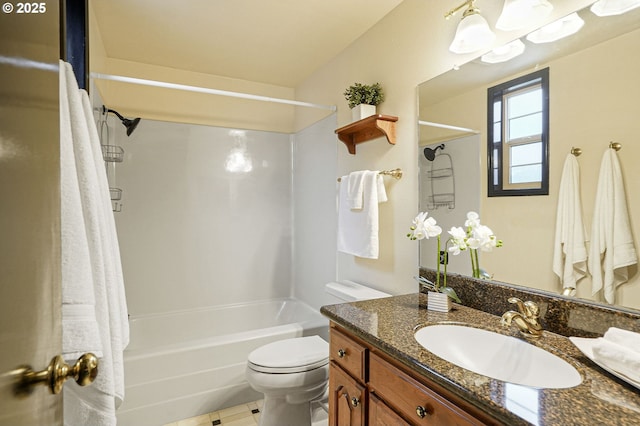 full bathroom featuring toilet, vanity, and washtub / shower combination