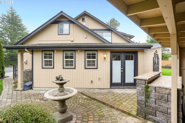 back of property featuring french doors and a patio