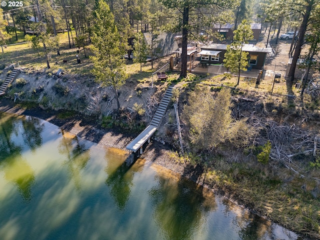 aerial view of property and surrounding area featuring a large body of water