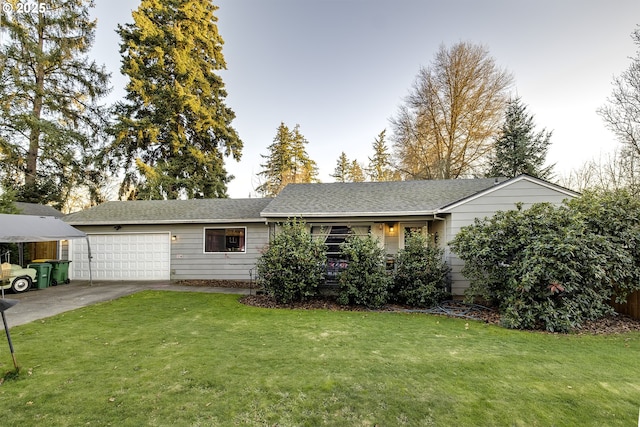 ranch-style home with a garage and a front lawn