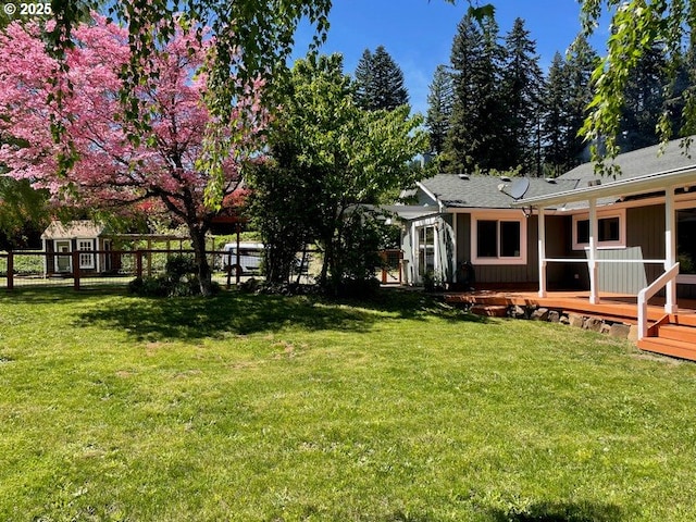 11081 Cook Underwood Rd, Underwood, WA 98651 - view of yard featuring a storage unit, a wooden deck, and an outdoor structure