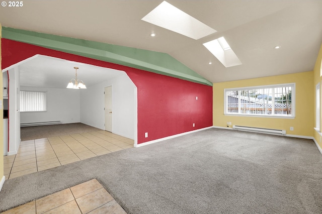 unfurnished living room featuring a baseboard heating unit, vaulted ceiling with skylight, carpet, and a notable chandelier