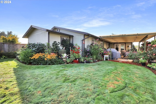 exterior space featuring a patio area and a front lawn