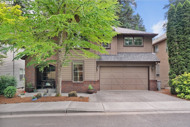 10886 SW Bretton Ct, Portland, OR 97224 - view of front of property with brick siding, an attached garage, and driveway