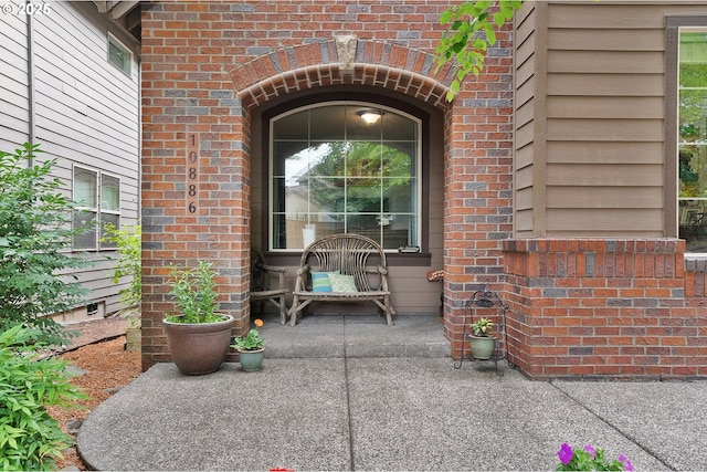 10886 SW Bretton Ct, Portland, OR 97224 - property entrance featuring brick siding