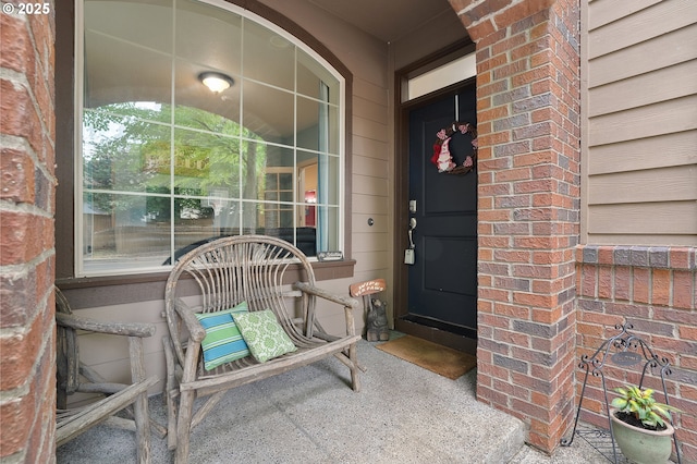 10886 SW Bretton Ct, Portland, OR 97224 - doorway to property featuring brick siding