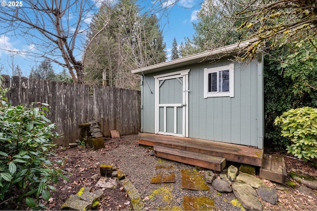 view of shed with fence private yard