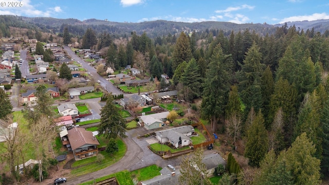 birds eye view of property featuring a residential view and a view of trees