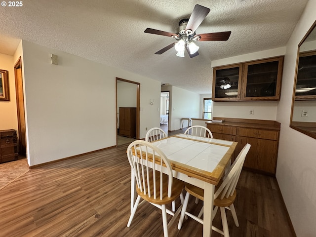13821 NW 10th Ct Unit G, Vancouver, WA 98685 - dining area featuring a textured ceiling, dark wood-type flooring, and ceiling fan