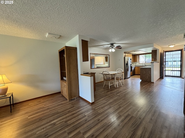 13821 NW 10th Ct Unit G, Vancouver, WA 98685 - kitchen with stainless steel fridge, dark wood-type flooring, ceiling fan, a sink, and baseboards