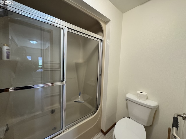 13821 NW 10th Ct Unit G, Vancouver, WA 98685 - full bathroom featuring toilet and bath / shower combo with glass door
