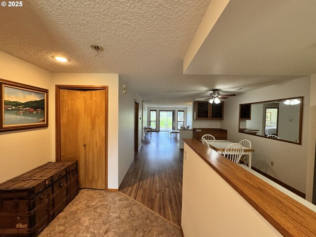 13821 NW 10th Ct Unit G, Vancouver, WA 98685 - corridor with a textured ceiling and dark wood-type flooring