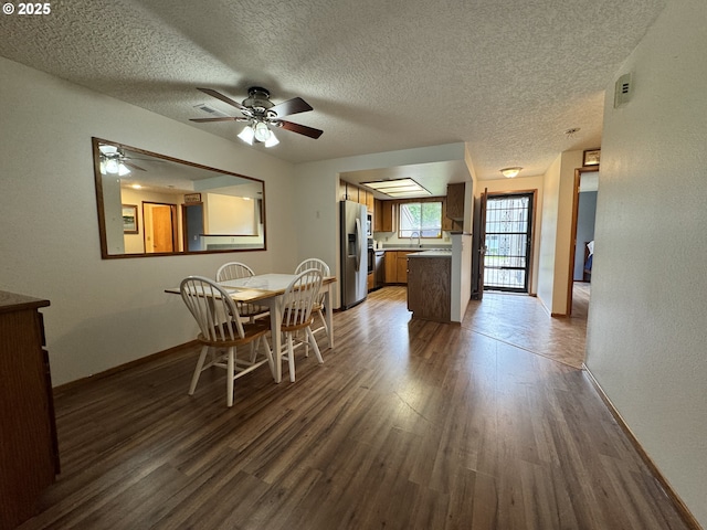 13821 NW 10th Ct Unit G, Vancouver, WA 98685 - dining room with wood finished floors, ceiling fan, a textured ceiling, and baseboards