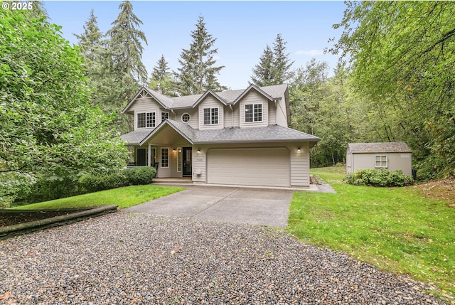 view of front of house featuring a front lawn, a garage, and a storage unit