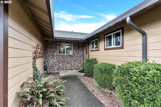 entrance to property with brick siding