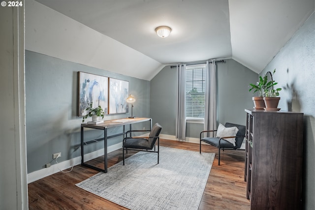 home office featuring hardwood / wood-style floors and vaulted ceiling