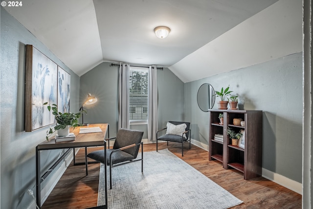 office space with wood-type flooring and lofted ceiling