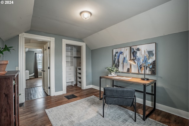 home office with dark hardwood / wood-style floors and vaulted ceiling