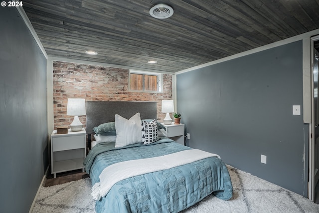 bedroom featuring crown molding, brick wall, and wooden ceiling