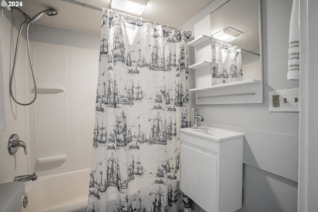 bathroom featuring shower / bath combo and vanity