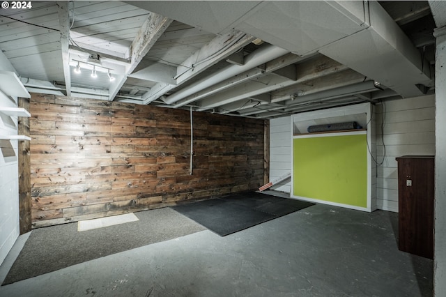 garage featuring wooden walls