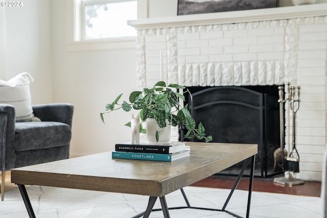 interior details with a brick fireplace