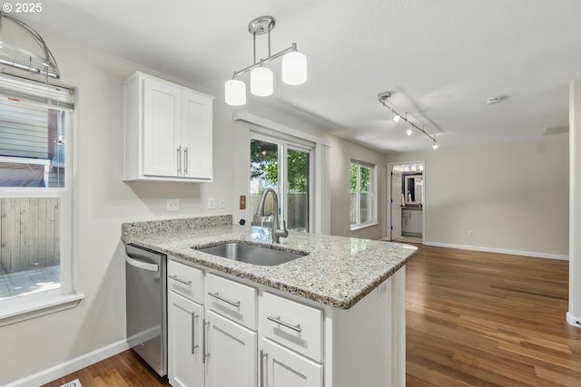 7091 SE Austin Dr, Hillsboro, OR 97123 - kitchen with dishwasher, a peninsula, white cabinetry, dark wood-style floors, and light stone countertops