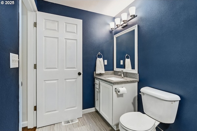 7091 SE Austin Dr, Hillsboro, OR 97123 - half bathroom with vanity and wood finished floors