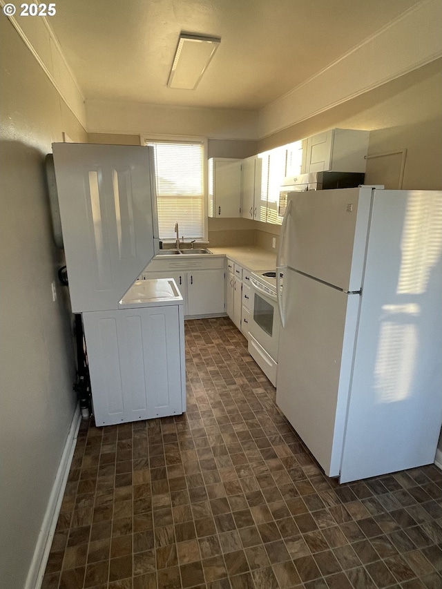 kitchen with white cabinetry, white appliances, and sink