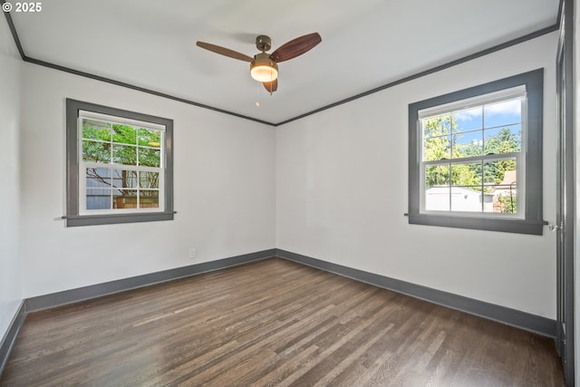 6406 N Michigan Ave, Portland, OR 97217 - empty room featuring plenty of natural light, dark wood-style flooring, baseboards, and ornamental molding