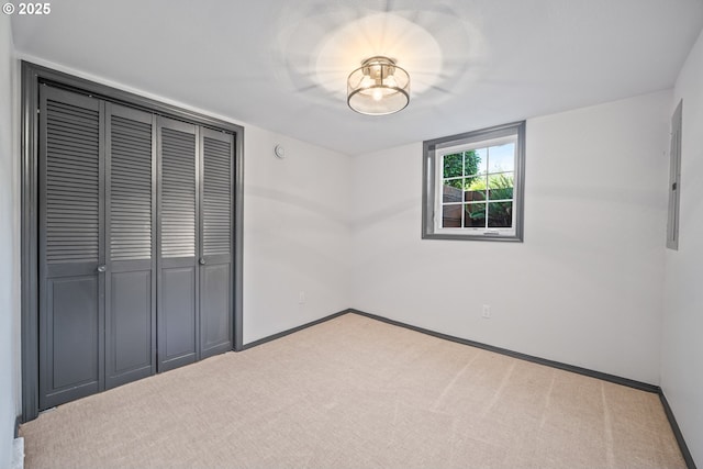6406 N Michigan Ave, Portland, OR 97217 - unfurnished bedroom with a closet, carpet flooring, baseboards, and electric panel