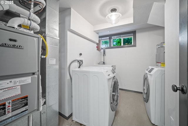 6406 N Michigan Ave, Portland, OR 97217 - laundry area featuring washer and dryer, heating unit, and water heater
