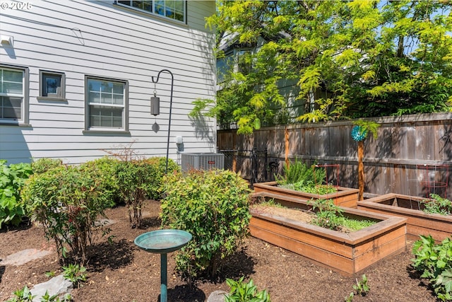 6406 N Michigan Ave, Portland, OR 97217 - view of yard featuring a vegetable garden and central AC