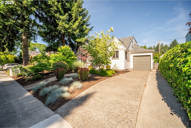 6406 N Michigan Ave, Portland, OR 97217 - view of property hidden behind natural elements featuring a garage, concrete driveway, and roof with shingles