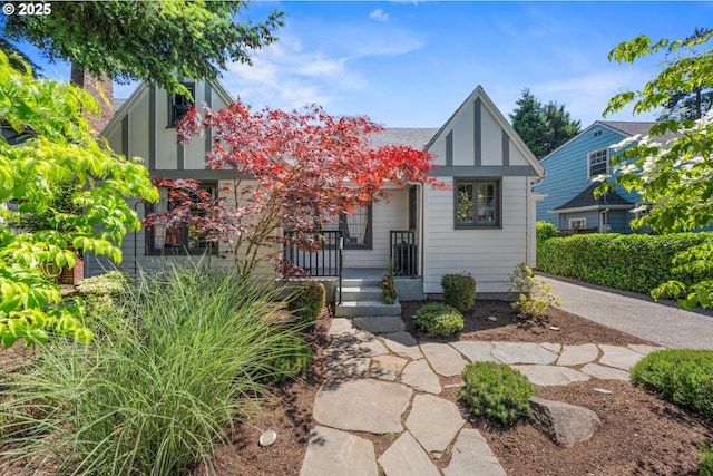 6406 N Michigan Ave, Portland, OR 97217 - tudor house featuring a porch