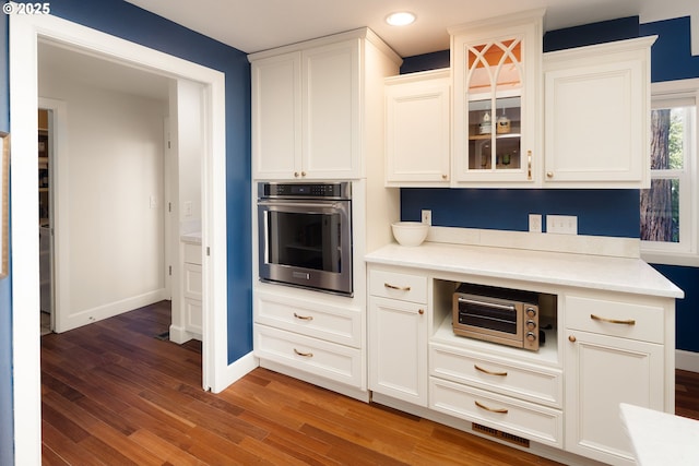 2977 Ingalls Way, Eugene, OR 97405 - kitchen featuring stainless steel oven, wood finished floors, recessed lighting, baseboards, and light countertops