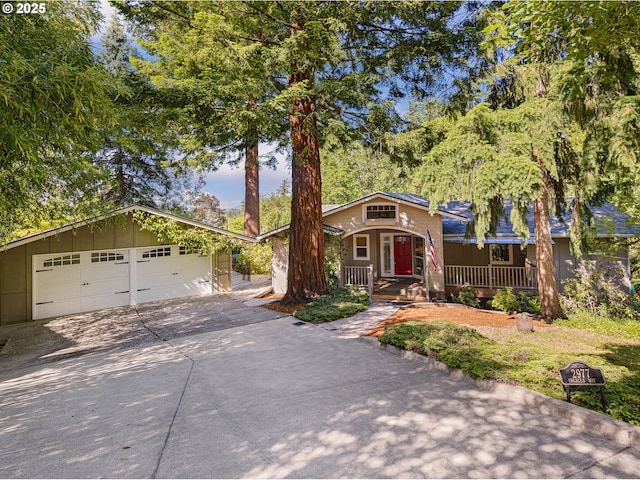 2977 Ingalls Way, Eugene, OR 97405 - view of front of property featuring concrete driveway, an attached garage, and covered porch